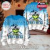 Carolina Panthers Grinch Christmas sweater front and back with team name, Santa hat, snowflakes, and holiday lights in decorated room!