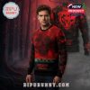 Man in red and black Chicago Bears x Stranger Things Christmas sweater with dark forest background and glowing team logo.
