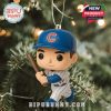 Chicago Cubs ornament of a batter in action, hung on a decorated tree branch.