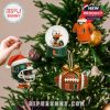 Miami Hurricanes holiday ornaments displayed on a Christmas tree with lights and festive setup.