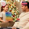 Girl gifting The Beach Boys calendar to her dad near Christmas tree with lights and laughter!