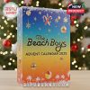 Beach-themed 2025 advent calendar box with palm trees and ornaments beside holiday decor!
