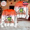 Full view of a holiday sweater set showing both front and back designs of the Grinch in a Browns Santa hat with glittery lettering and snowflake details!