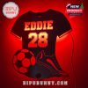 A customizable LED light in the shape of a soccer jersey with personalized name, number, soccer ball, and soccer shoe in red lighting for a vibrant decor piece.
