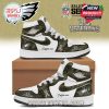 Philadelphia Eagles custom high-top sneakers featuring camouflage design, pink swoosh, and U.S. Veterans tribute. These shoes can be personalized with a custom name tag.