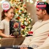 Holiday family exchange with Five Finger Death Punch calendar as a gift, placed in front of a Christmas tree to highlight the excitement of metal-themed holiday fun!