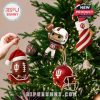 Tree decorated with Indiana Hoosiers-themed holiday ornaments, showing a player figure, candy-striped stocking, and helmet under warm Christmas lights!