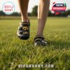 Iowa Hawkeyes clogs worn outdoors on grass with festive Jibbitz and team strap!