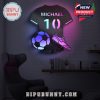 A customizable LED light in the shape of a soccer jersey with a personalized name, number, soccer ball, and shoe for a unique decor piece.