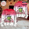 Full holiday look of the Grinch Chiefs ugly sweater, showing every angle of the design in a Christmas-decorated interior scene!