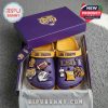 LSU-themed Crocs in branded box on gray carpet under daylight!