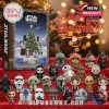 Star Wars holiday advent calendar and mini figures arranged in front of Christmas tree.