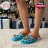 Miami Dolphins Crocs worn indoors near Christmas tree with presents in background!