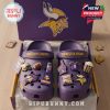 Minnesota Vikings Crocs in purple with team charms in a branded box on wooden surface!