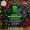 A close-up of the Monster Supercross Advent Calendar 2025 with holiday decorations, green ornaments, red bows, and a motocross bike rider printed on the box!