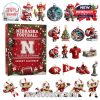 Holiday-themed Nebraska Football advent calendar placed in a snowy Christmas village background with footballs and decorations!
