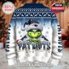 Back of a blue and white Patriots Christmas sweater with Grinch graphic and festive winter patterns!
