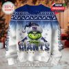 Holiday sweater with a New York Giants Grinch design, snowflakes, and Christmas lights on a white and blue background!