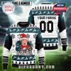 Philadelphia Eagles holiday sweater with team logos and Home Alone graphic.