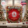 A glowing, festive Ohio State Buckeyes advent calendar placed in a cozy Christmas setting with snowflakes, baubles, and stadium background!