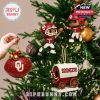 Themed tree ornaments from the Oklahoma calendar hung on green branches, adding team pride to the holiday spirit!