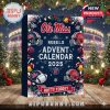 Front view of the Ole Miss Rebels 2025 Advent Calendar with holiday designs, placed outdoors in front of Christmas trees and twinkling stadium lights!