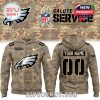 A camouflage hoodie with the Philadelphia Eagles logo, customizable name and number, and American flag on the sleeve for the Salute to Service campaign.
