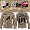 A camouflage hoodie with the Detroit Lions logo, customizable name and number, and American flag on the sleeve for Salute to Service.