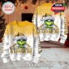 Front and back views of the Pittsburgh Steelers themed Grinch Christmas sweater shown in a cozy setting with soft lighting and festive decor.