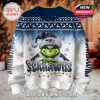 Front design of a Seattle Seahawks Grinch sweater featuring snowflake motifs, holiday lights, and bold team branding with the Grinch in the center.