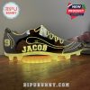 A yellow glowing football shoe light with customizable text for personalization.