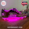 A pink glowing football shoe light with customizable text to add a personal touch.