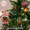 Ornaments inspired by Snoop Dogg in various festive outfits hang from a decorated Christmas tree, surrounded by warm fairy lights and holiday baubles!