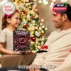 A joyful moment of gift-giving featuring a child handing over a Gamecocks-themed advent calendar as part of the holiday tradition!
