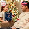A smiling child offers the Virginia Cavaliers Advent Calendar to her dad by the Christmas tree, symbolizing festive cheer and sports pride!