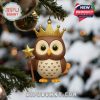 An elegant owl ornament with royal golden accents displayed on a Christmas tree!