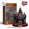 AC/DC figurine set featuring the band members in Christmas sweaters, placed in front of a decorated Christmas tree.