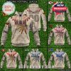 Tan hoodies with tribal feathers, team logos, and heritage-style patterns for Commanders, Chiefs, Cardinals, 49ers, Seahawks, and Bills, plus “00” number on back!
