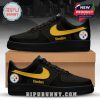 Black Steelers sneakers featuring yellow details and the team’s official logo near the heel.