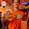 Celebration moment featuring the Ducks 33rd anniversary whiskey glass held high, with branding and fan pride on full display!