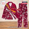 A red Arizona Cardinals pajama set with floral and helmet patterns, designed with customization options for fan names!