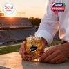 Commemorative whiskey glass featuring Army Black Knights logo with golden ice and stadium background at sunset.
