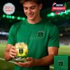Austin FC fan holding a green themed whiskey glass inside a soccer stadium.