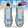 Overhead angle of character-themed sneakers with Bluey’s face on the tongue and playful paw prints across the surface!