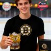 A young hockey supporter displays a special Bruins glass with skyline engraving and the iconic 