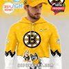 A man wears a bright yellow Boston Bruins hoodie and cap set with Bluey characters, combining hockey fandom with family-friendly style!