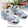A pair of vibrant sneakers decorated with BT21 and BTS elements, shown against a backdrop of BTS members. The shoes include multiple character illustrations, soft blue tones, and playful design details!