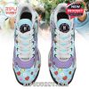 Aerial view of BTS TN sneakers with detailed character patterns and BTS logo on each tongue, surrounded by playful color tones and soft laces!