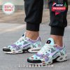 Person wearing vibrant BTS TN sneakers with BT21 designs and colorful accents, photographed in an urban outdoor setting!