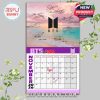 BTS November 2026 calendar page with peaceful seaside background, BTS logo in black, and printed autographs from all members.